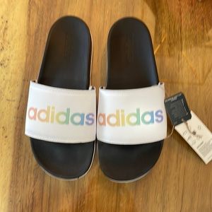 NWT men’s adidas adilette. Size 8. White with rainbow Text